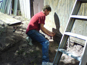 original man fixing something original fixing something